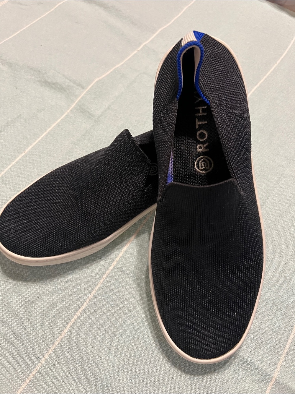 Rothy's Black Knit Slip-On Sneakers with Blue Trim